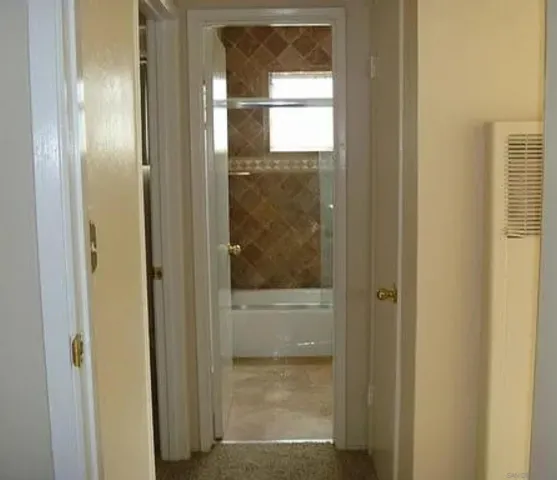 a bathroom with a glass shower door
