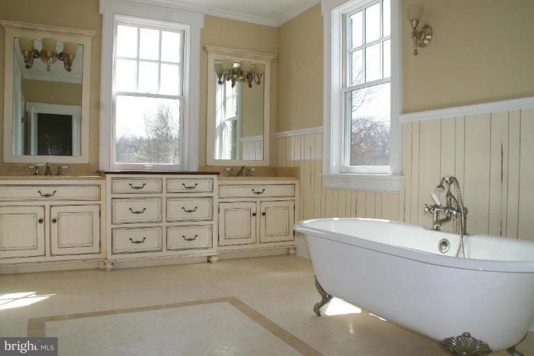 1304 Ruxton Road Ruxton, MD 21204 - Photo 11 of 20 a spacious bathroom with sink and mirror with bathtub