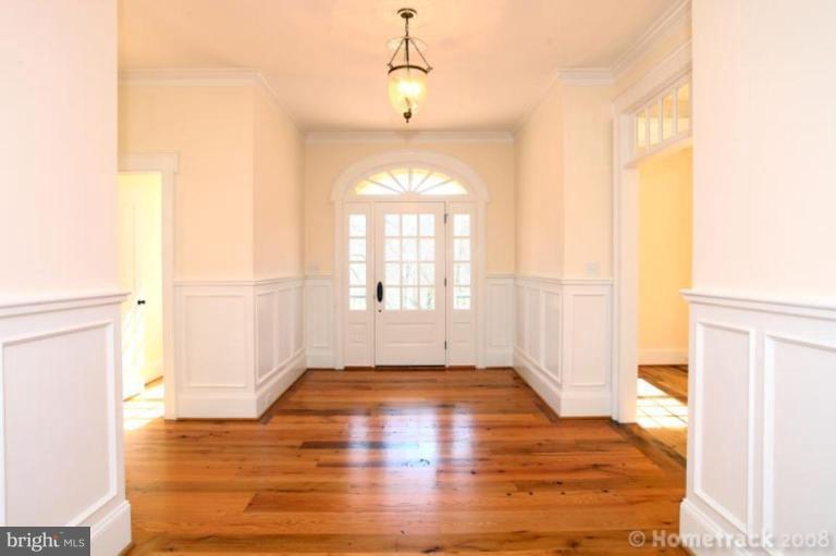 1304 Ruxton Road Ruxton, MD 21204 - Photo 20 of 20 a view of empty room with wooden floor and fan