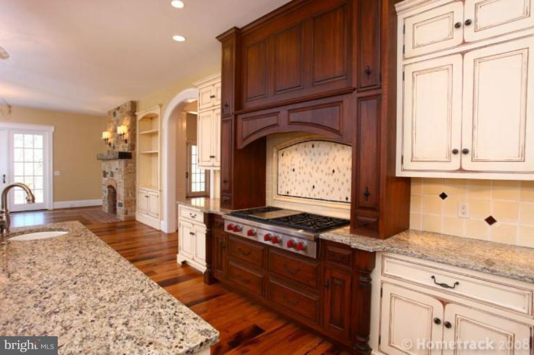 1304 Ruxton Road Ruxton, MD 21204 - Photo 4 of 20 a kitchen with stainless steel appliances granite countertop a stove and a refrigerator