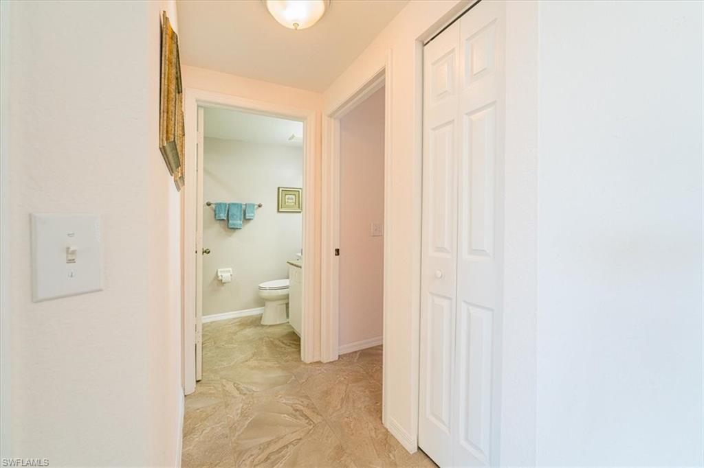 186 Gabriel Circle, Unit 3903 Naples, FL 34104 - Photo 13 of 42 Hall with baseboards