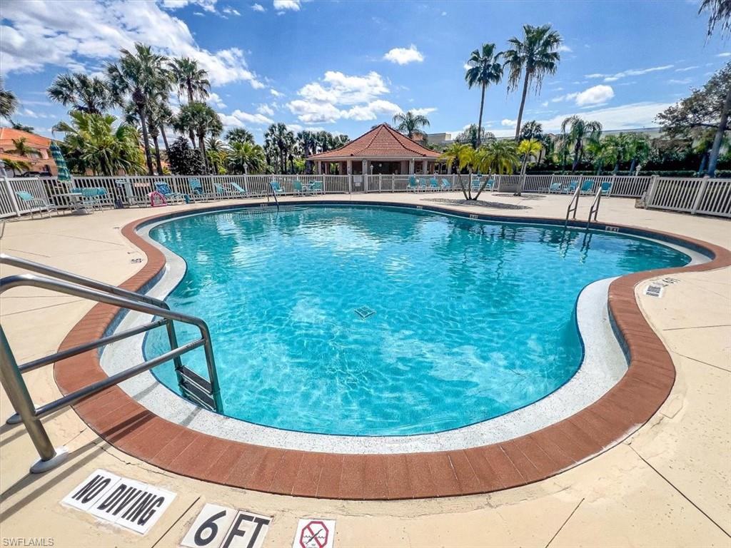 186 Gabriel Circle, Unit 3903 Naples, FL 34104 - Photo 25 of 42 Community pool featuring a patio area and a gazebo