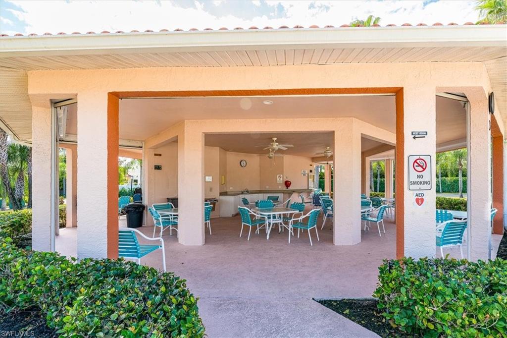 186 Gabriel Circle, Unit 3903 Naples, FL 34104 - Photo 30 of 42 View of patio / terrace with outdoor dining area