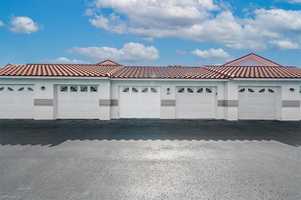 186 Gabriel Circle, Unit 3903 Naples, FL 34104 - Photo 3 of 42 View of garage