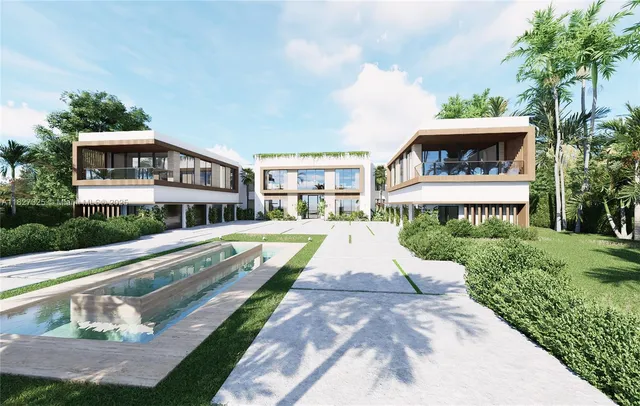 a view of a house with a yard and potted plants