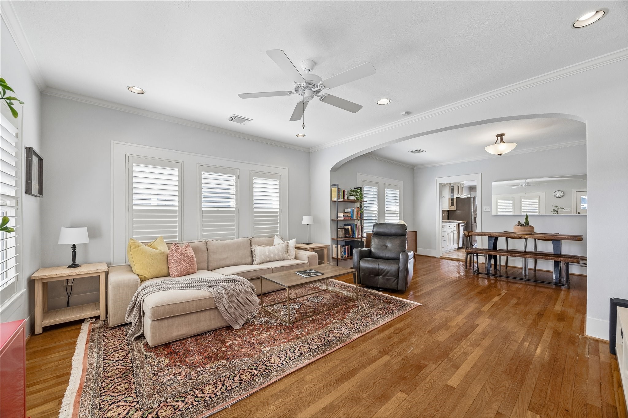 919 Key Street Houston, TX 77009 - Photo 5 of 39 An expansive living area defined by warmth and openness, where seamless flow and timeless finishes create an inviting space for both relaxation and gathering.