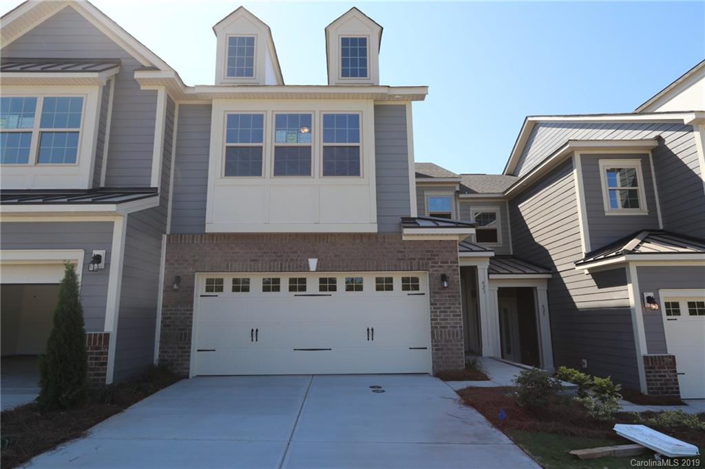 623 Amber Meadows Way, Unit 273 Tega Cay, SC 29708 - Photo 1 of 9 a front view of a house with windows