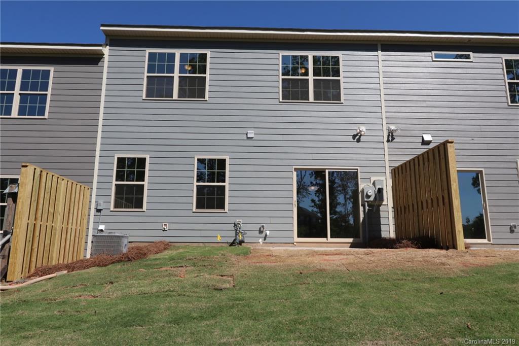 623 Amber Meadows Way, Unit 273 Tega Cay, SC 29708 - Photo 2 of 9 a view of front of house with yard