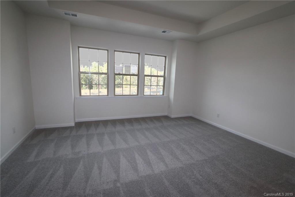 623 Amber Meadows Way, Unit 273 Tega Cay, SC 29708 - Photo 4 of 9 an empty room with a window