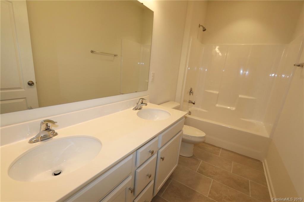 623 Amber Meadows Way, Unit 273 Tega Cay, SC 29708 - Photo 5 of 9 a bathroom with a sink and a tub