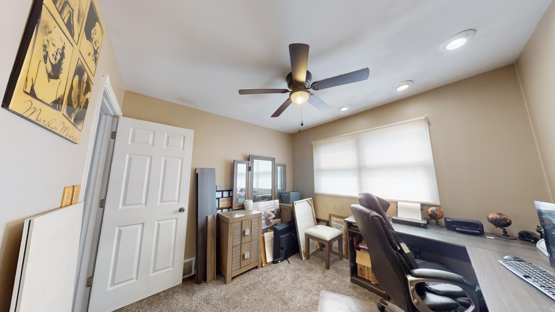 327 South 18th Street Chesterton, IN 46304 - Photo 15 of 29 a view of a workspace with furniture and a window