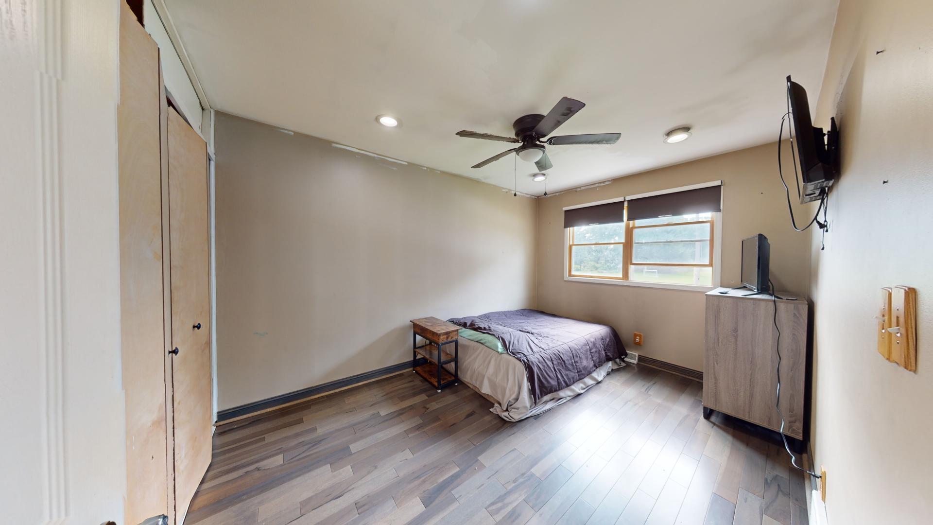 327 South 18th Street Chesterton, IN 46304 - Photo 16 of 29 a bedroom with a bed and a flat screen tv