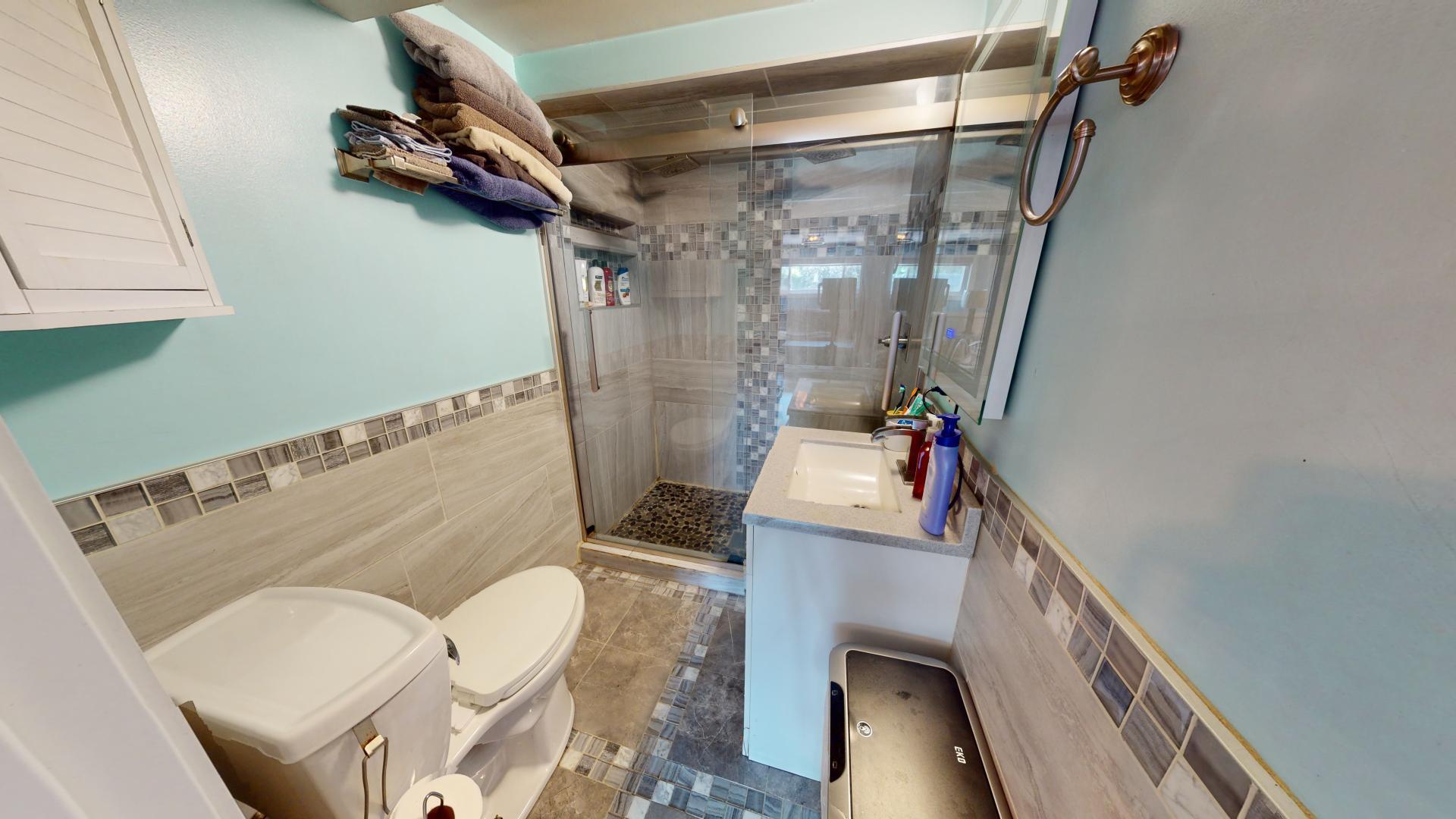 327 South 18th Street Chesterton, IN 46304 - Photo 21 of 29 a bathroom with a sink a toilet and shower