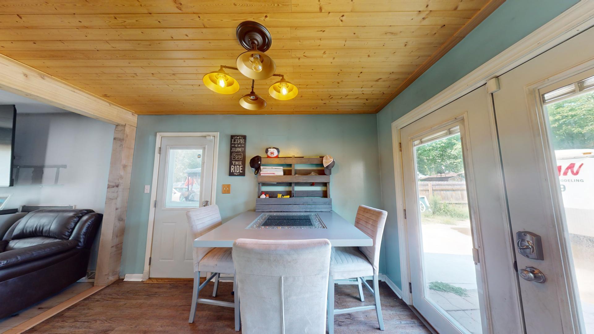 327 South 18th Street Chesterton, IN 46304 - Photo 8 of 29 a view of a dining room with furniture a chandelier and wooden floor