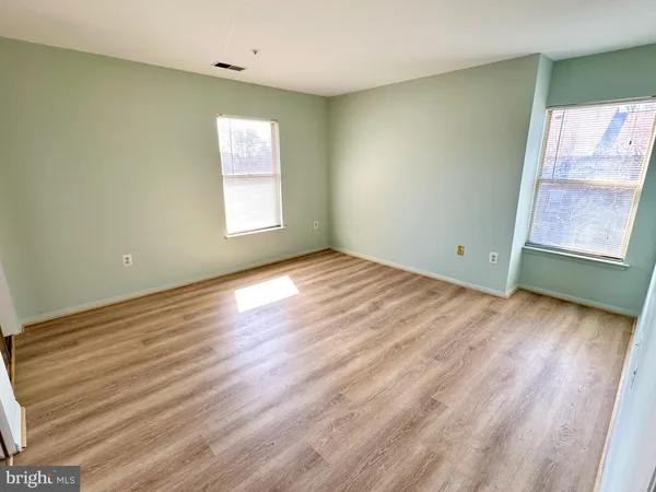 a bedroom with a bed and a mirror