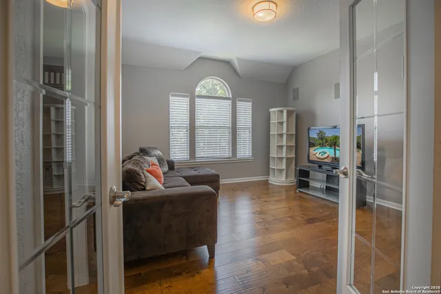 a living room with furniture and a window