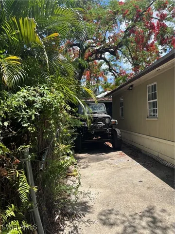 a view of a backyard of the house