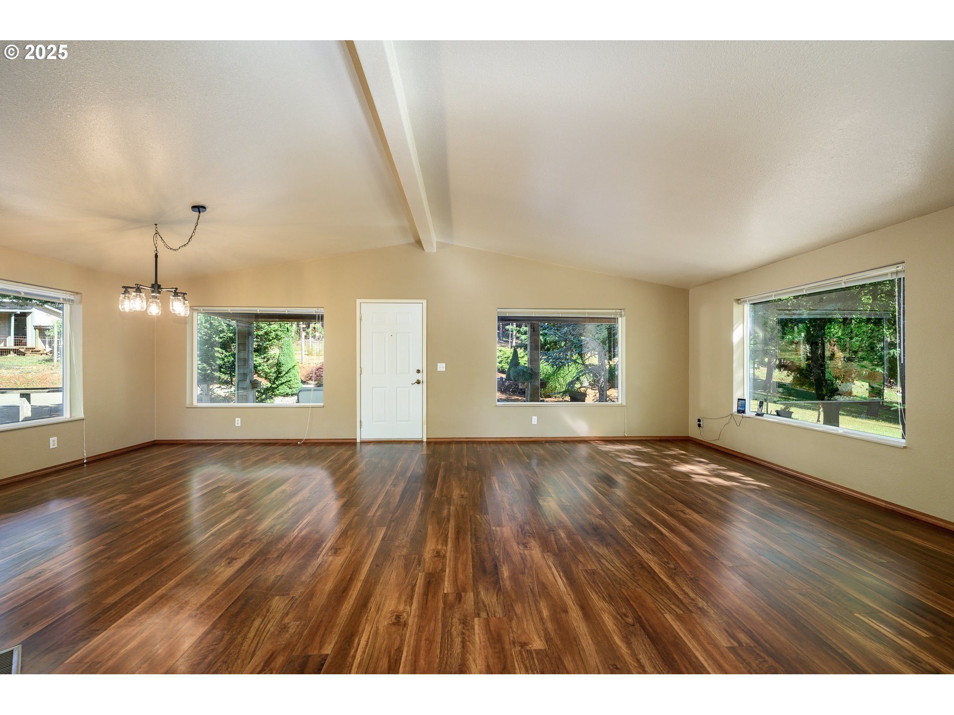 13330 Willamina Creek Road Willamina, OR 97396 - Photo 11 of 46 an empty room with wooden floor and windows