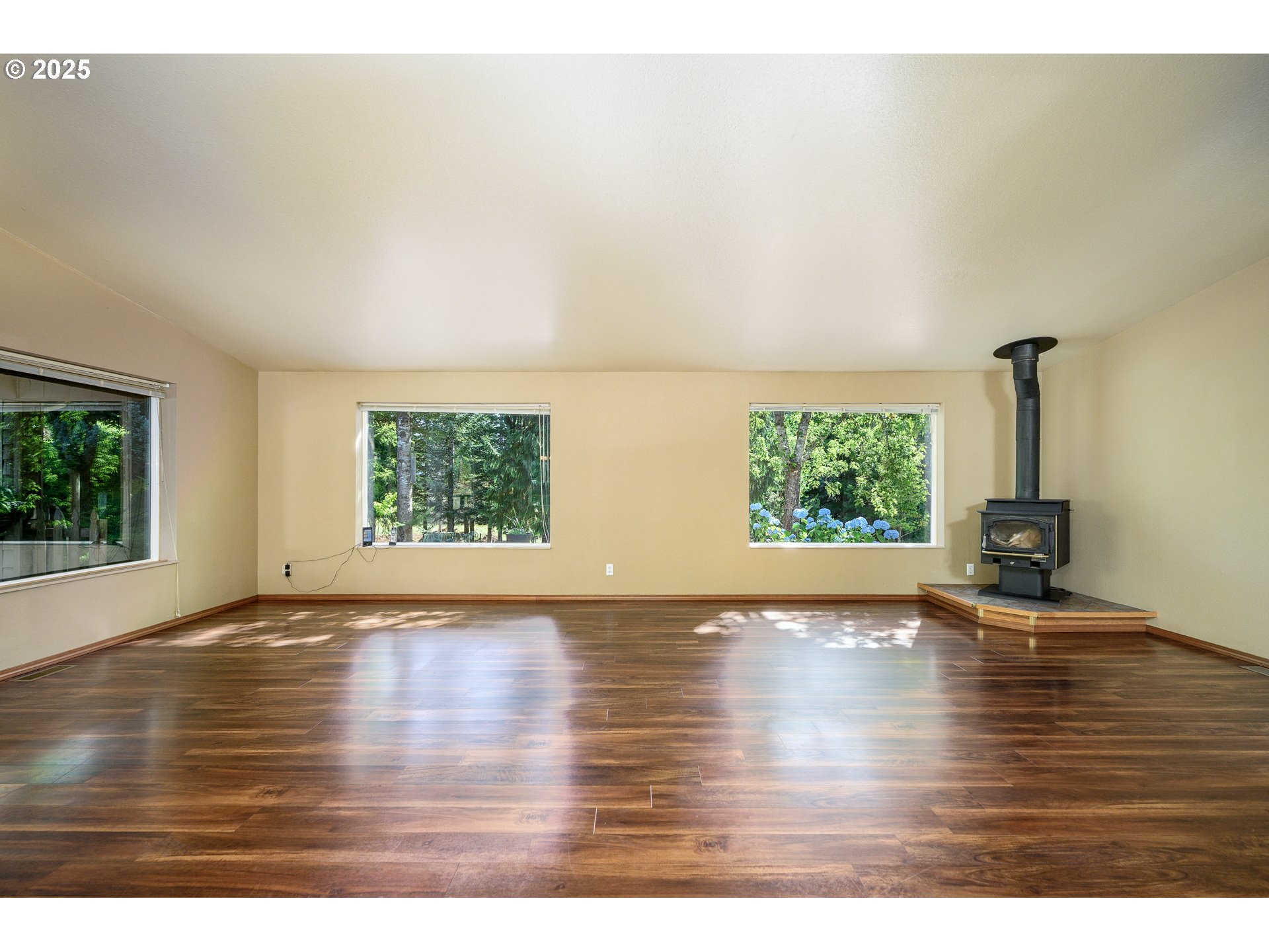 13330 Willamina Creek Road Willamina, OR 97396 - Photo 12 of 46 a view of an empty room with wooden floor and a window