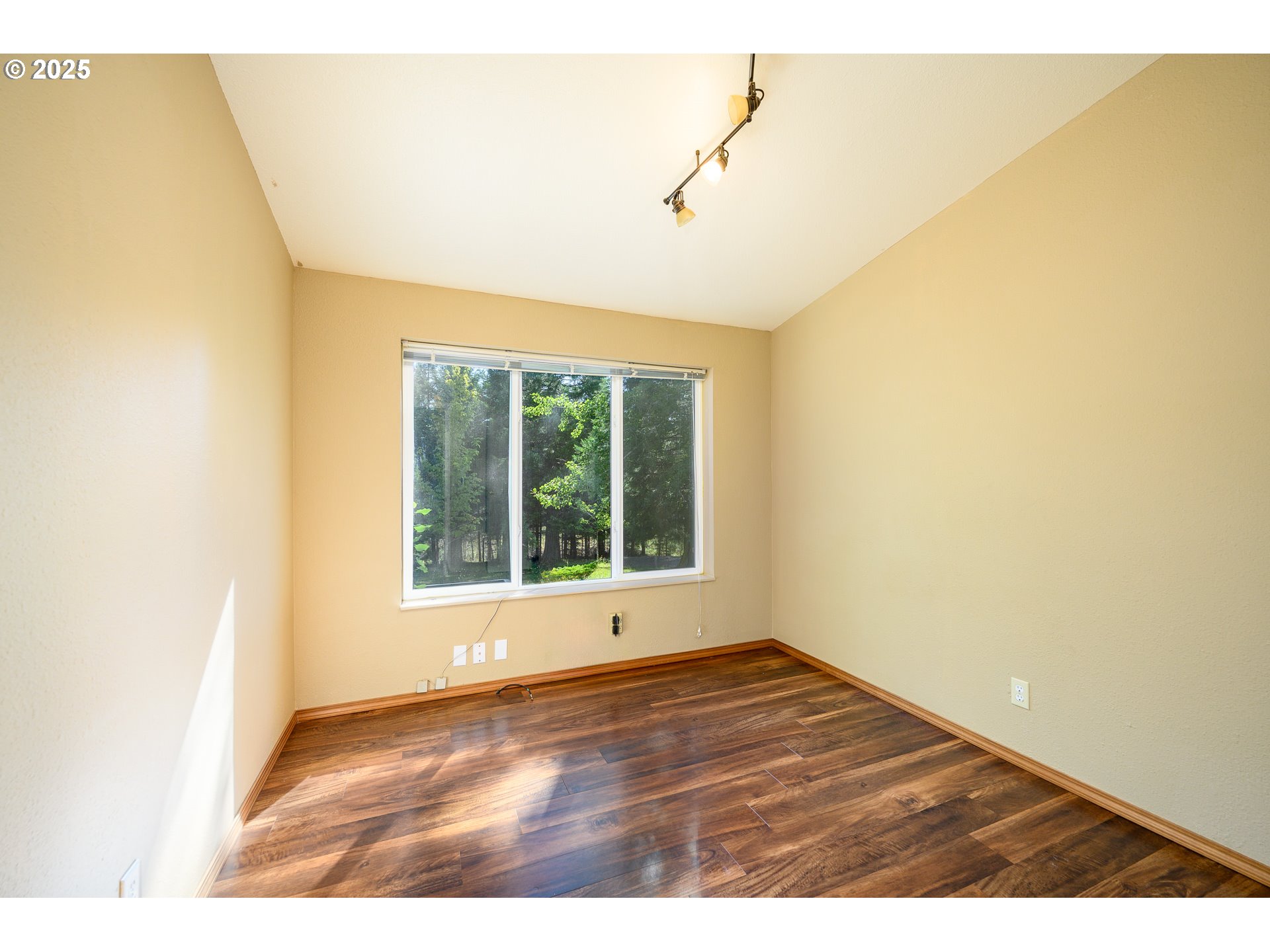 13330 Willamina Creek Road Willamina, OR 97396 - Photo 24 of 46 a view of an empty room with wooden floor and a window