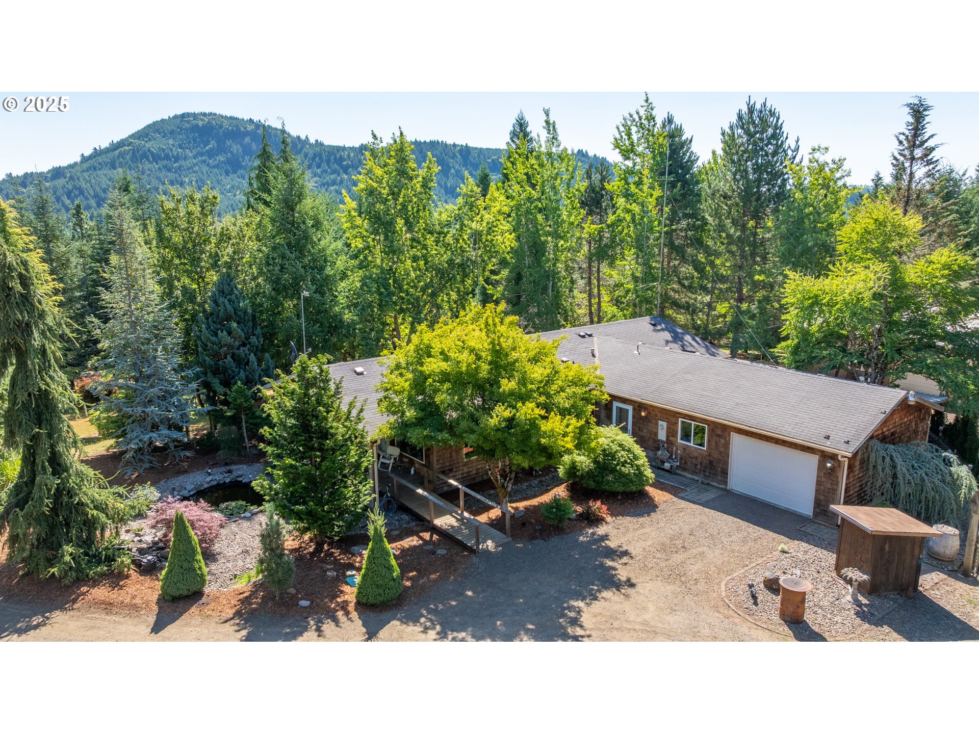 13330 Willamina Creek Road Willamina, OR 97396 - Photo 3 of 46 a backyard of a house with a yard and outdoor seating