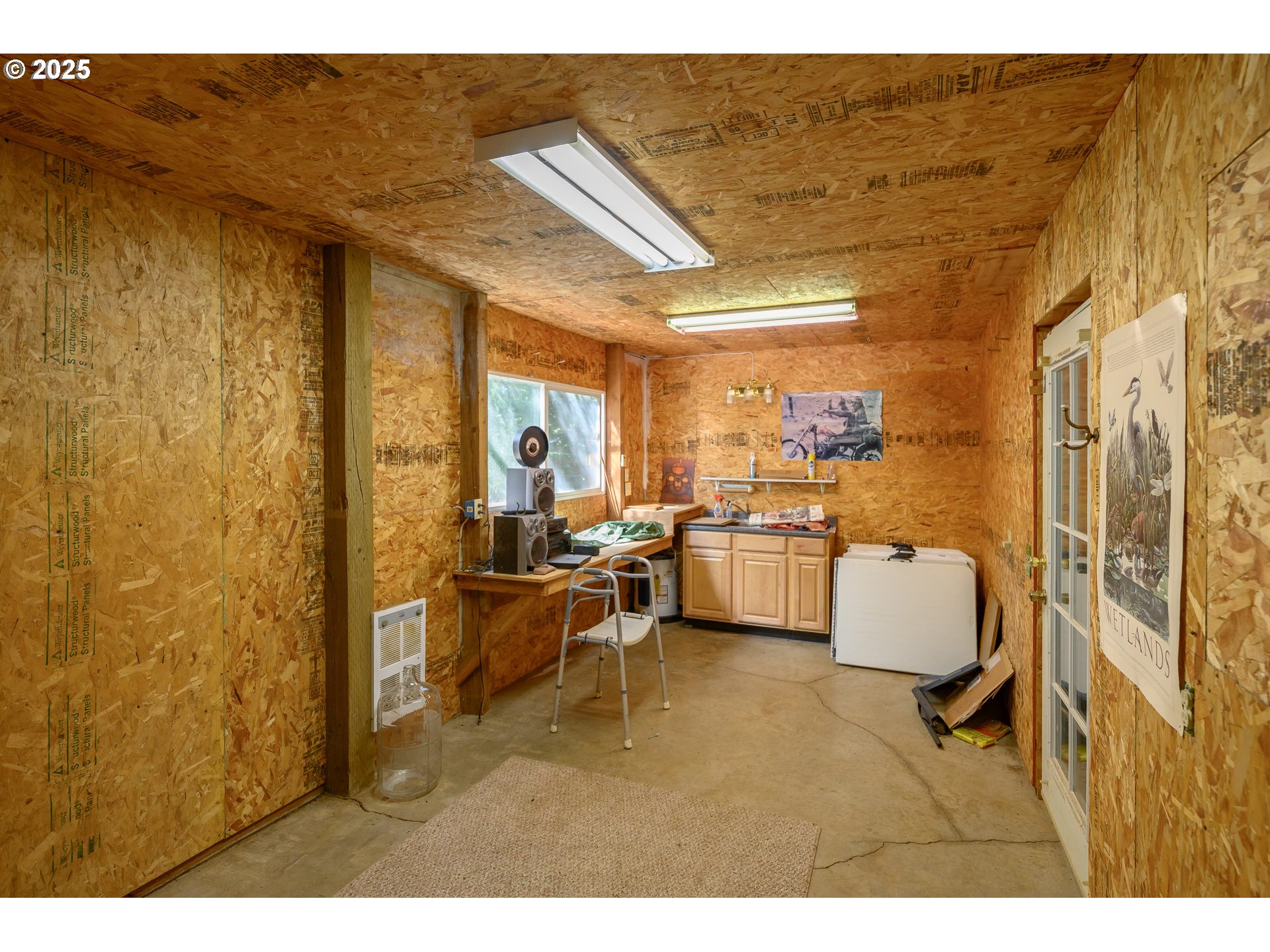 13330 Willamina Creek Road Willamina, OR 97396 - Photo 36 of 46 a living room with couches chair and a wall painting
