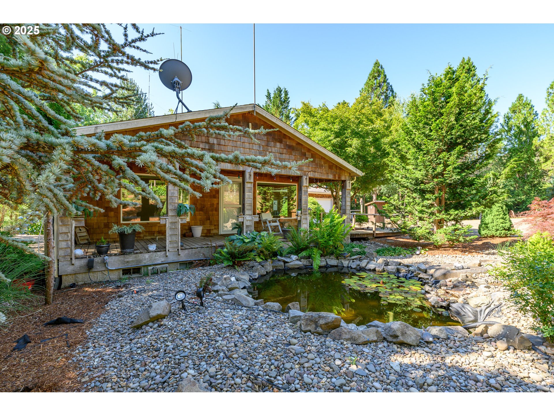 13330 Willamina Creek Road Willamina, OR 97396 - Photo 4 of 46 a view of a house with swimming pool and sitting area