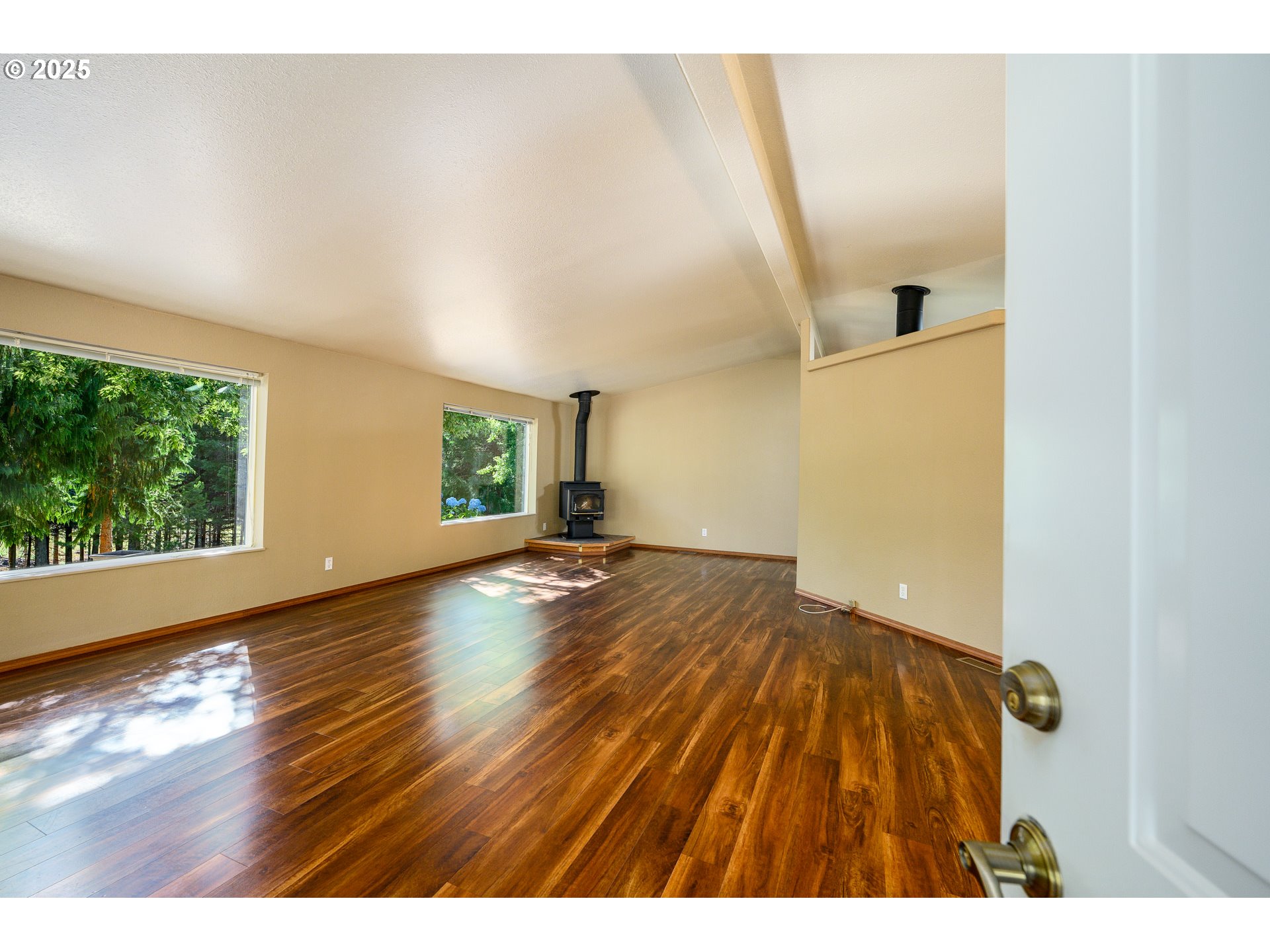 13330 Willamina Creek Road Willamina, OR 97396 - Photo 7 of 46 a view of empty room with wooden floor and fan