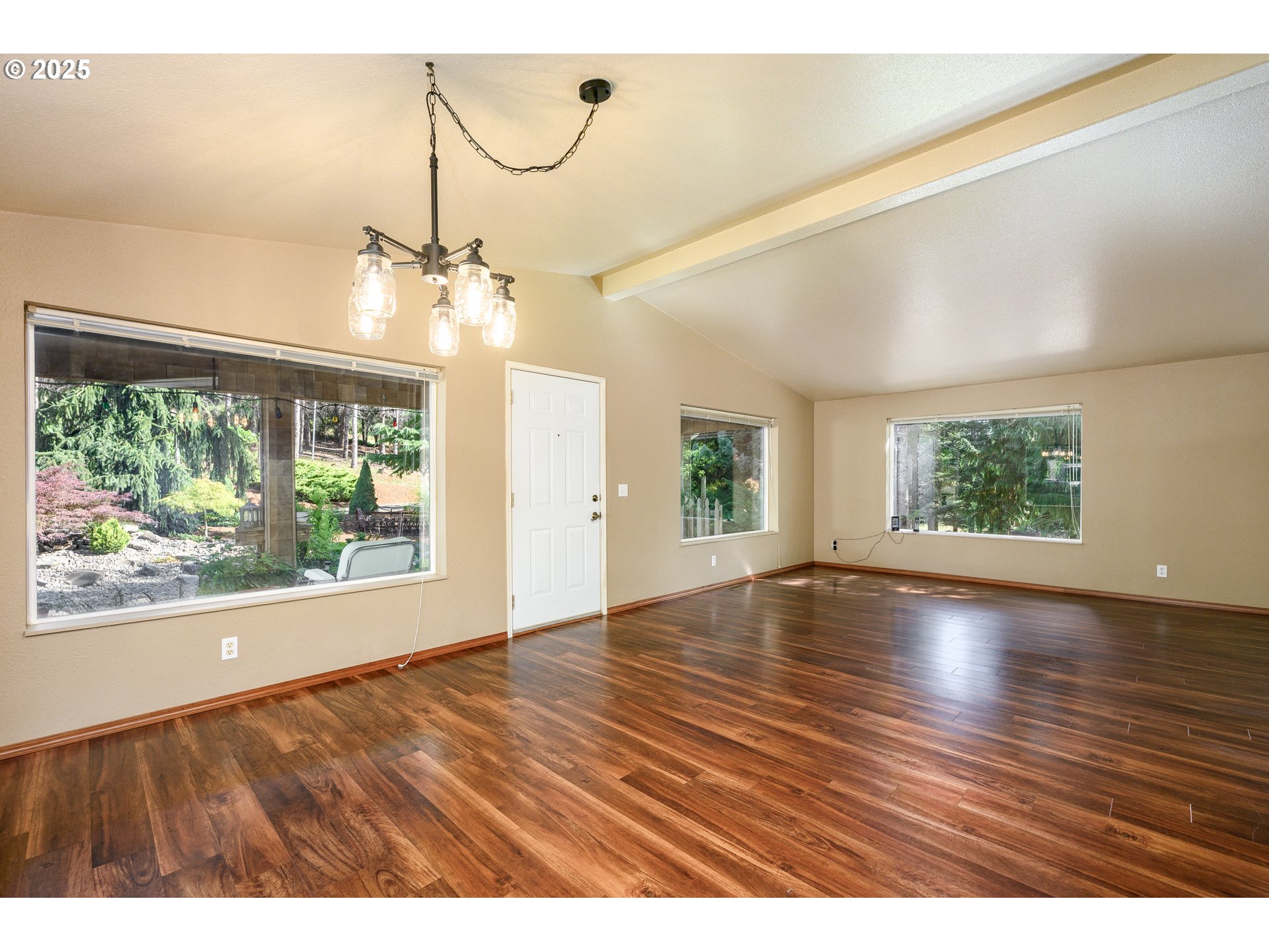 13330 Willamina Creek Road Willamina, OR 97396 - Photo 8 of 46 a view of an empty room with wooden floor and a window