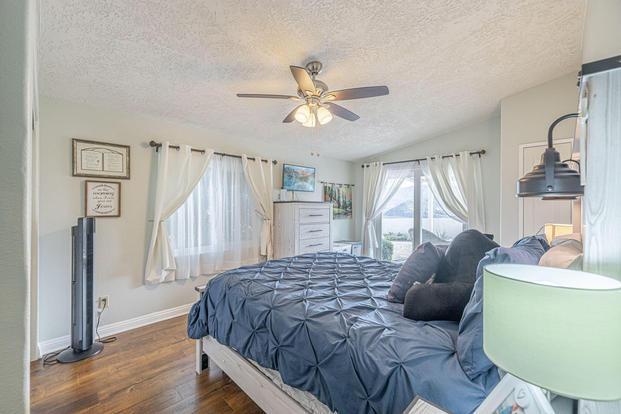 33105 Santiago Road Acton, CA 93510 - Photo 11 of 73 a bedroom with a bed dresser and a window
