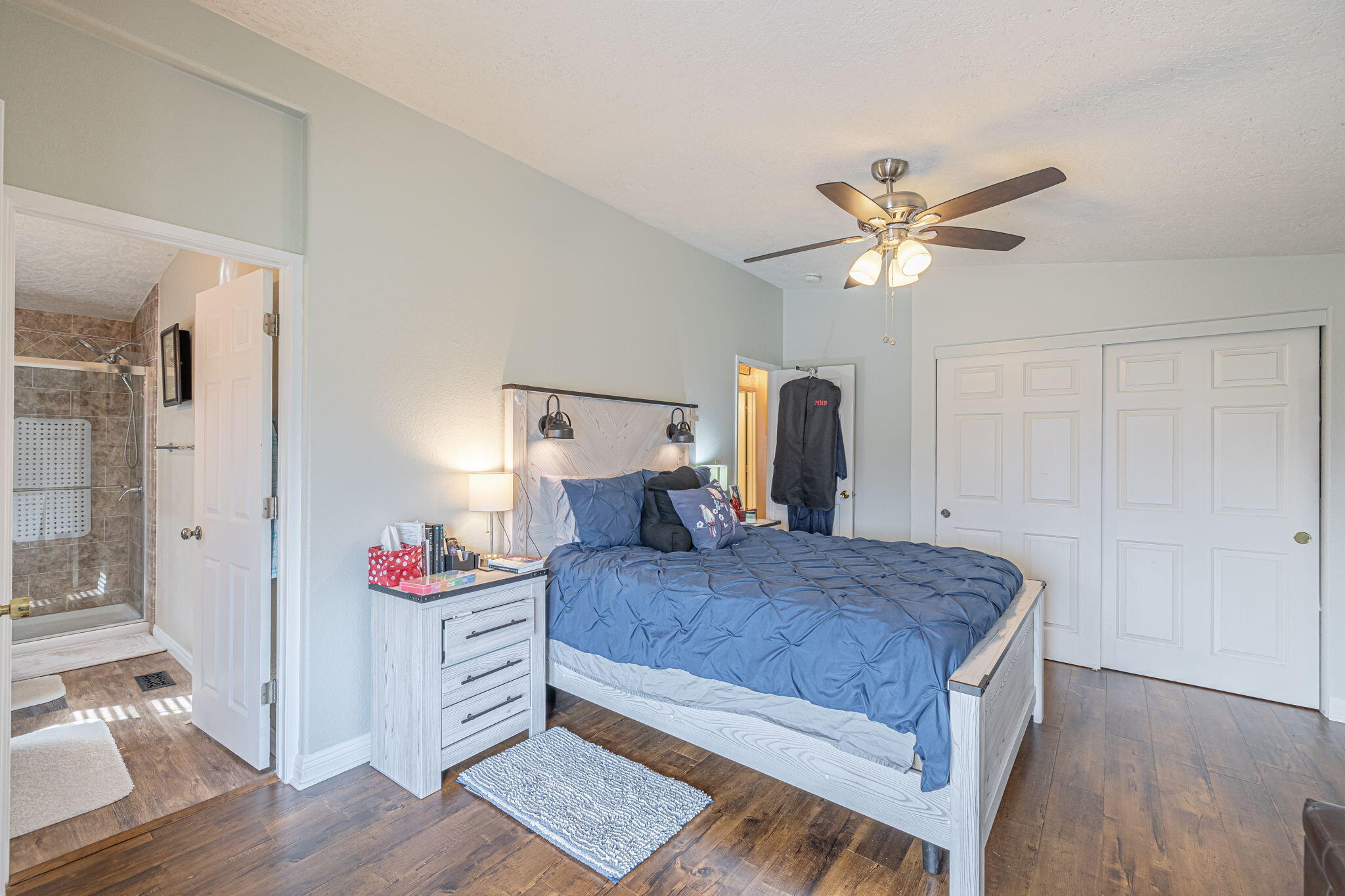 33105 Santiago Road Acton, CA 93510 - Photo 12 of 73 a bedroom with a bed and a chandelier