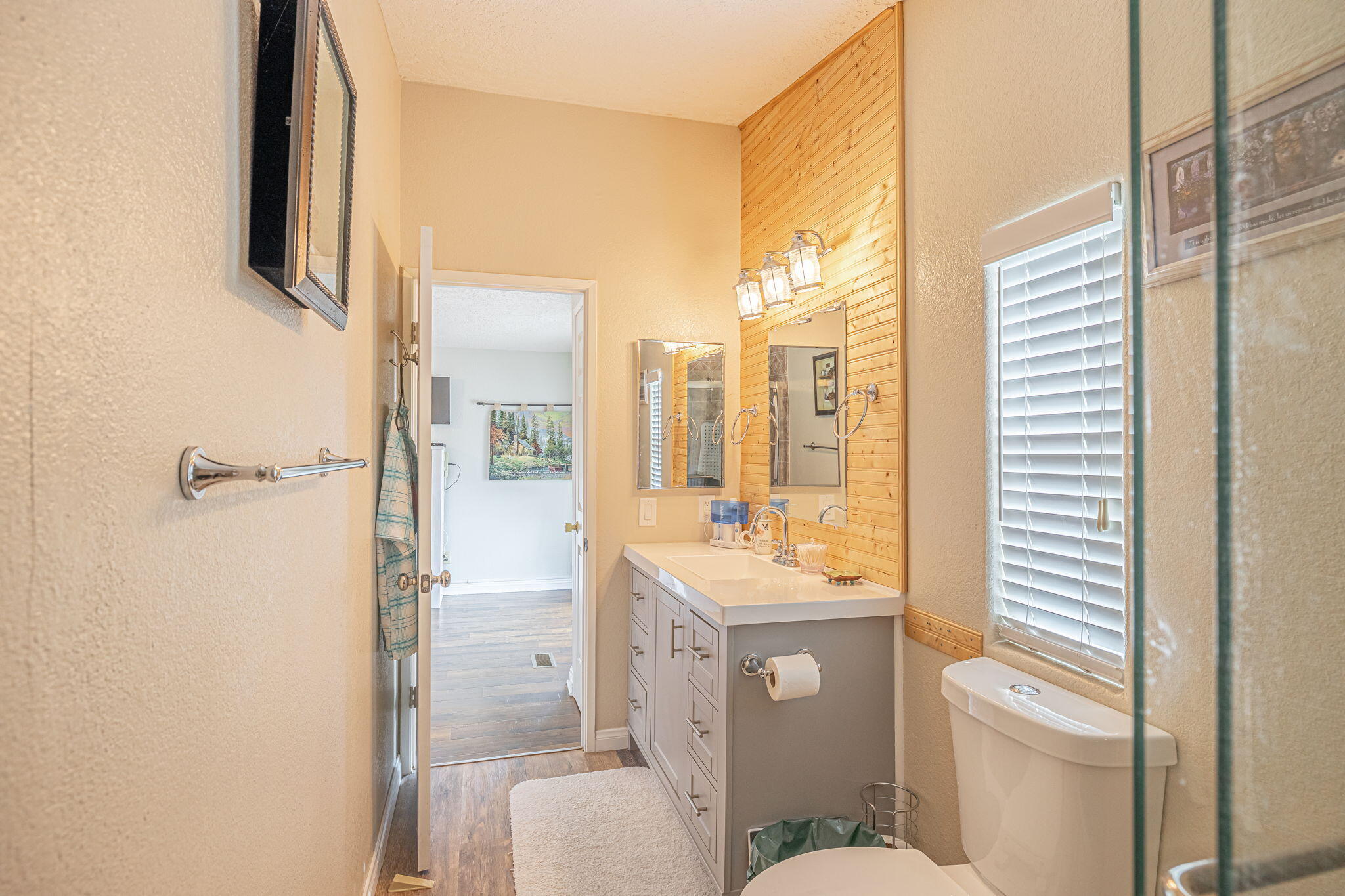 33105 Santiago Road Acton, CA 93510 - Photo 15 of 73 a bathroom with a sink a toilet and shower