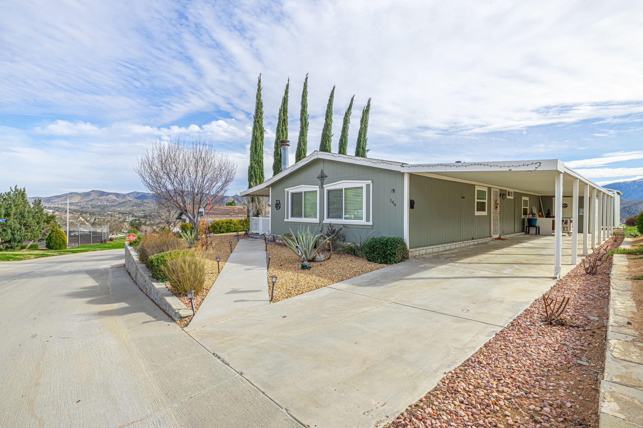 33105 Santiago Road Acton, CA 93510 - Photo 2 of 73 a front view of a house with a garden and pathway
