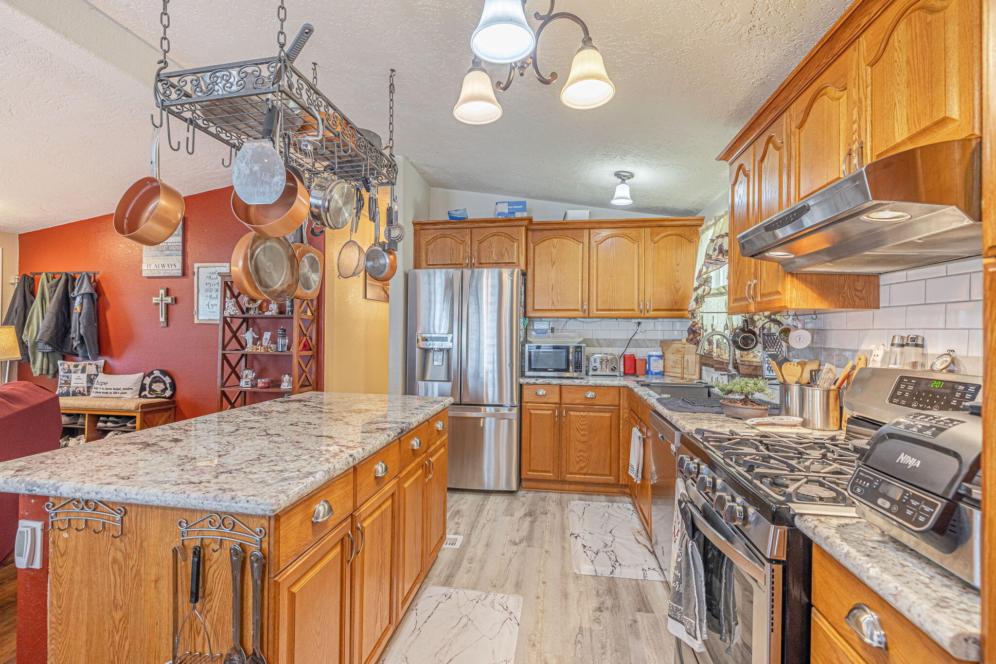 33105 Santiago Road Acton, CA 93510 - Photo 24 of 73 a kitchen with stainless steel appliances granite countertop a sink and cabinets