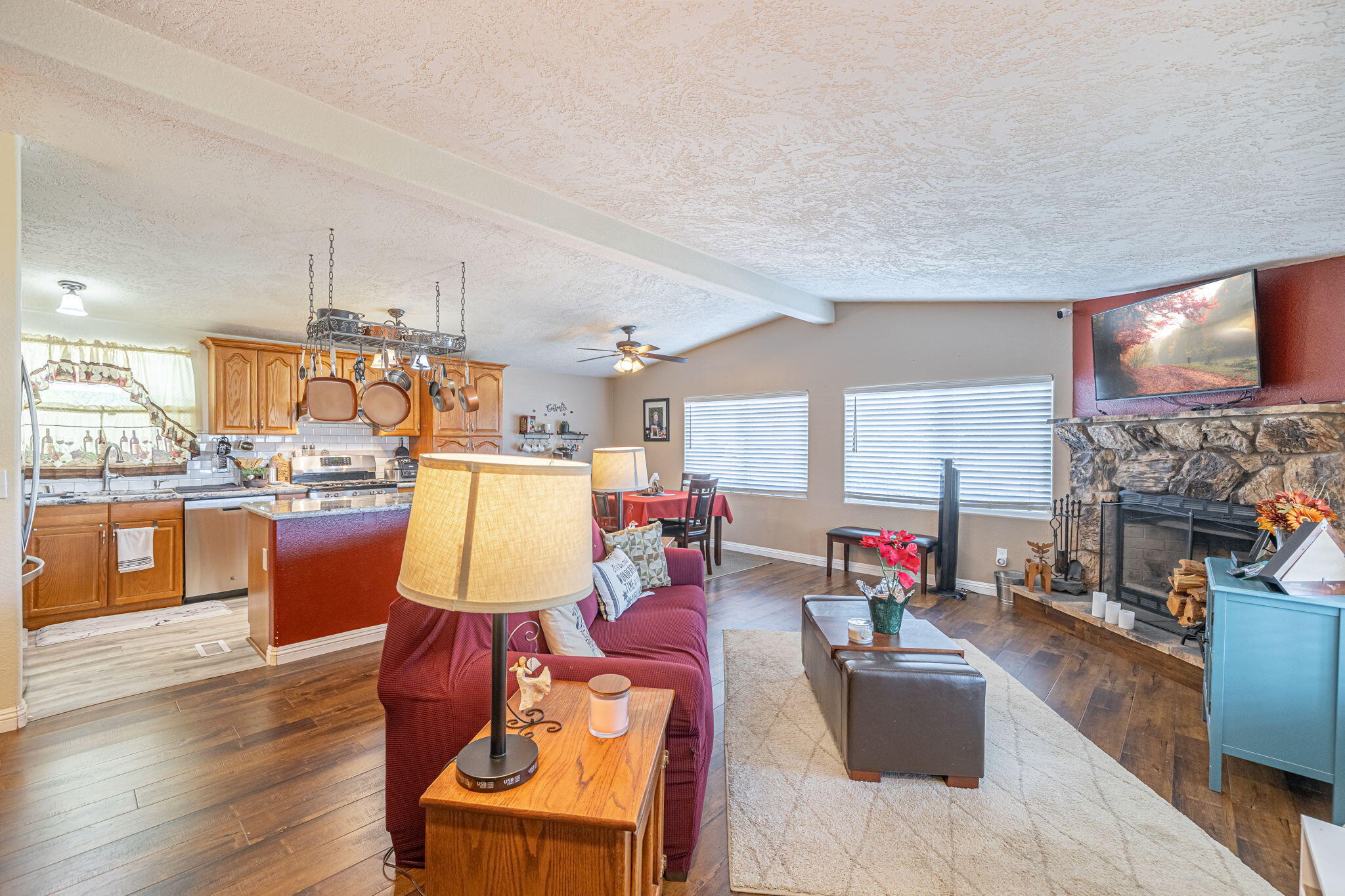 33105 Santiago Road Acton, CA 93510 - Photo 29 of 73 a living room with fireplace furniture and a wooden floor