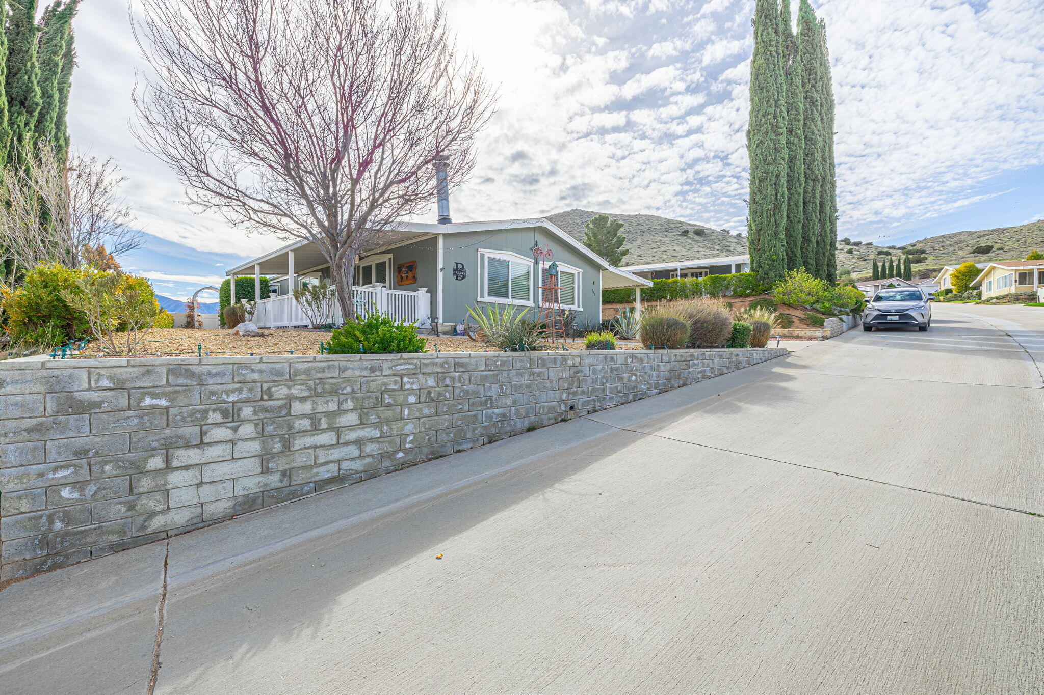 33105 Santiago Road Acton, CA 93510 - Photo 4 of 73 a front view of a house with a garden and entryway