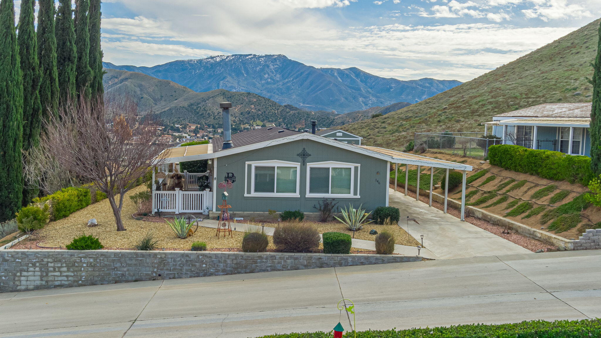 33105 Santiago Road Acton, CA 93510 - Photo 47 of 73 a front view of house with yard and mountain view in back