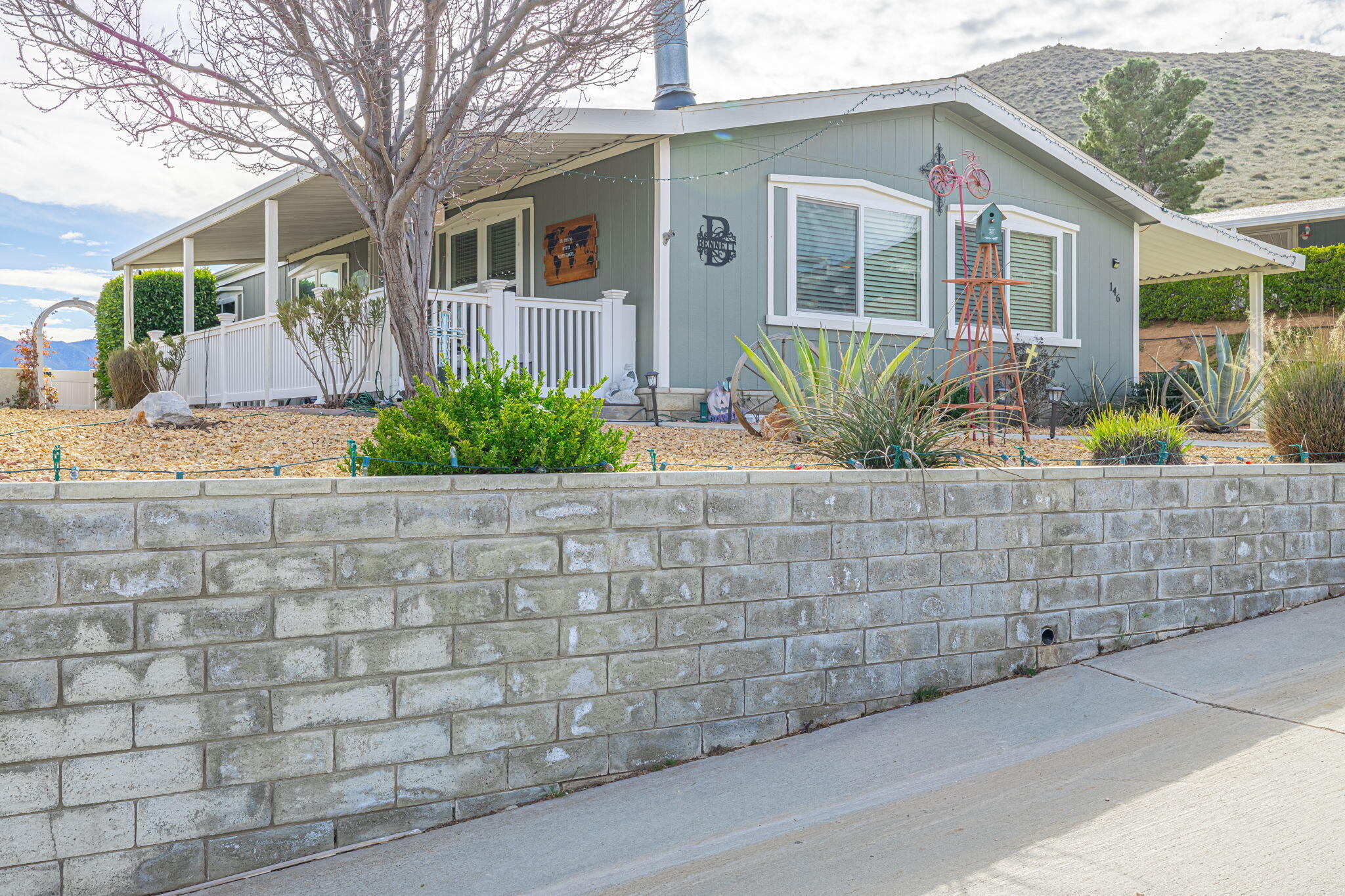 33105 Santiago Road Acton, CA 93510 - Photo 5 of 73 a front view of a house with a garden