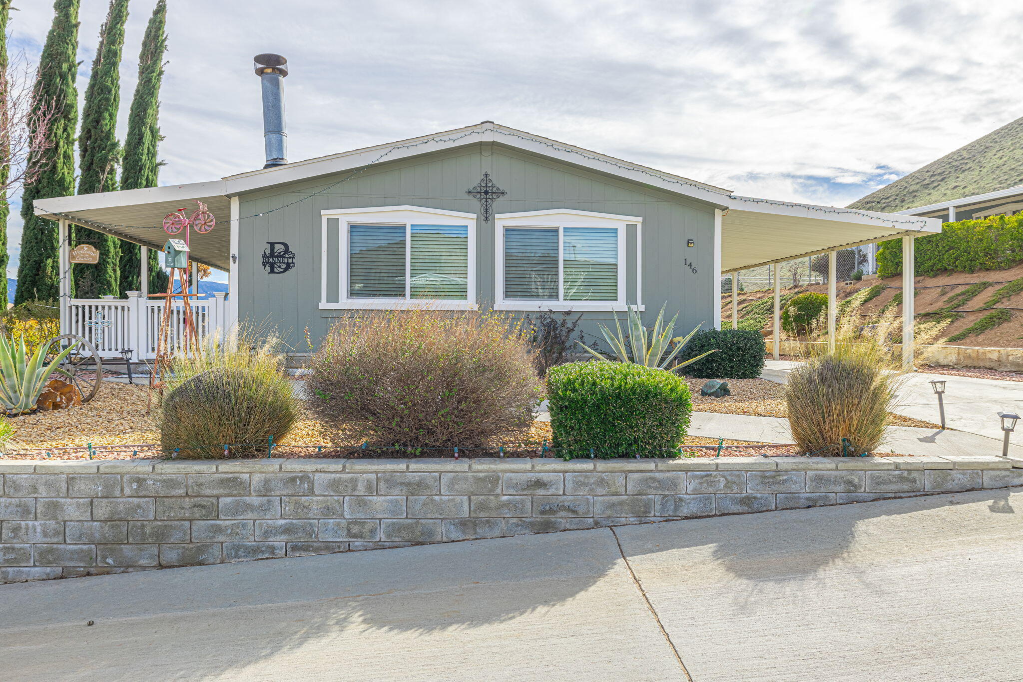 33105 Santiago Road Acton, CA 93510 - Photo 7 of 73 a view of a house with a yard and plants