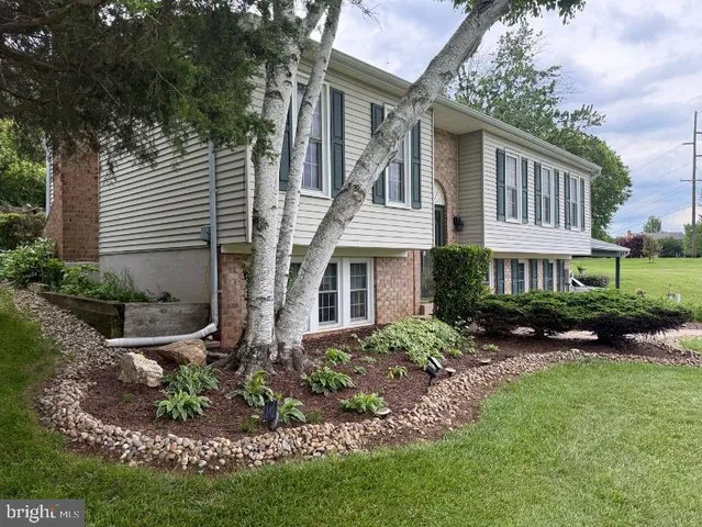 an aerial view of a golf course with a swimming pool