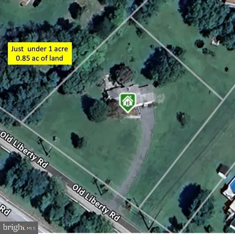 a view of a house with backyard porch and sitting area