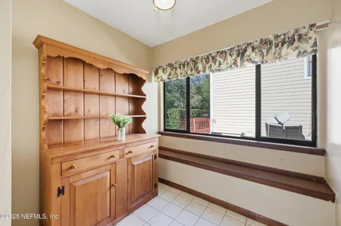 a bedroom with a bed dresser and a window