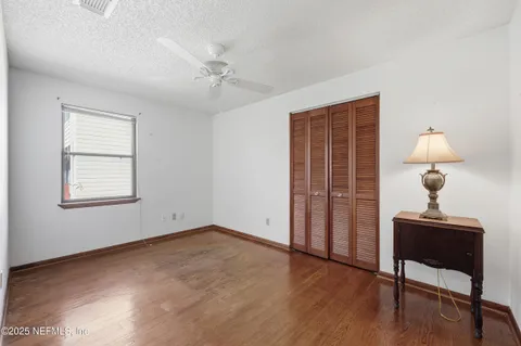 a view of an empty room with glass door