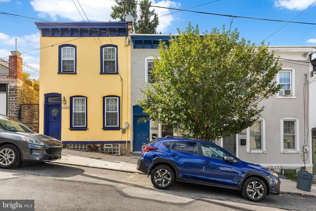 a car parked in front of a house
