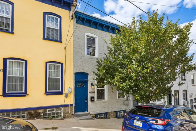 a front view of a house with parking