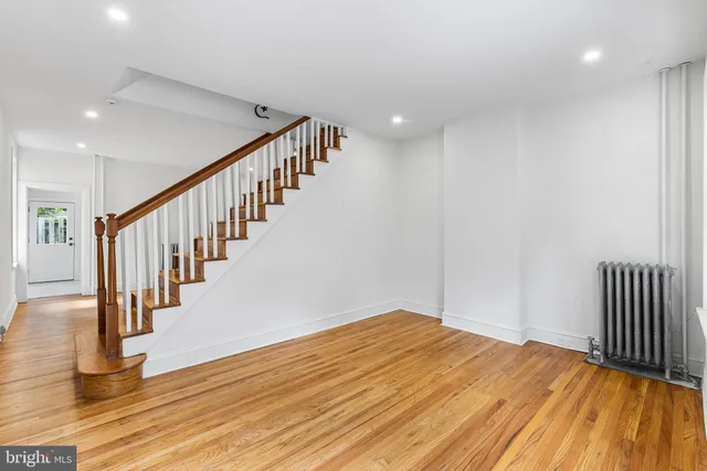 a view of hallway with wooden floor