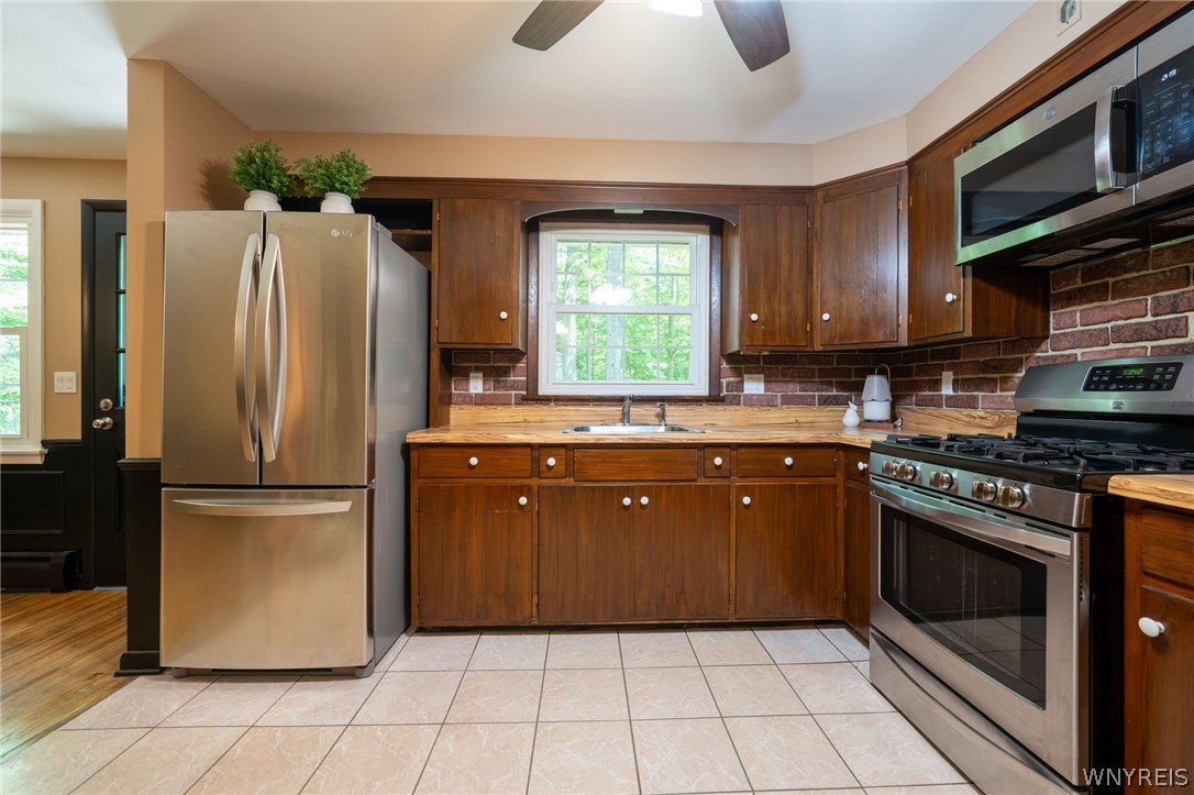 1928 Reading Road West Falls, NY 14170 - Photo 9 of 37 Kitchen with door to paito