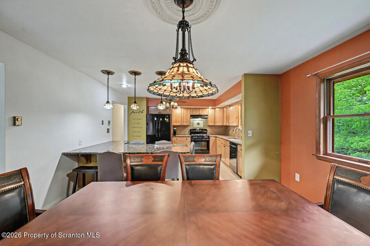211 Buckingham Street Moscow, PA 18444 - Photo 22 of 83 a view of a dining room with furniture window and wooden floor