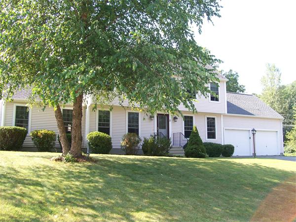 2 Forge Lane Sutton, MA 01590 - Photo 1 of 18 a front view of house with yard and green space