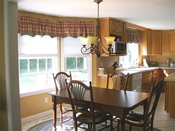2 Forge Lane Sutton, MA 01590 - Photo 4 of 18 a dining room with furniture a chandelier and wooden floor